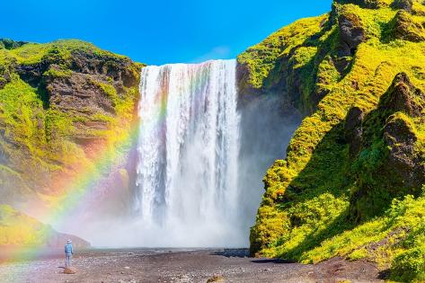 Photographic Print: Icelandic Landscape Concept – View of Famous Skogafoss Waterfall and Amazing Rainbow by murat4art: 12x8in